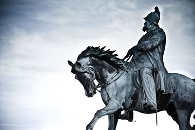 Low angle view of statue against sky