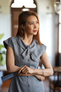 Close-up of woman posing indoors