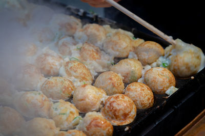 High angle view of meat on barbecue grill