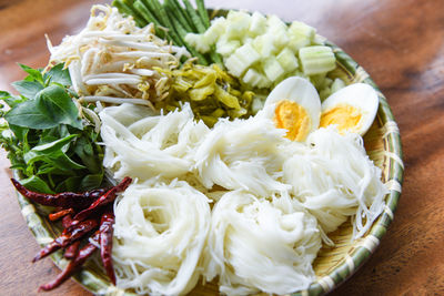 High angle view of chopped vegetables in plate on table