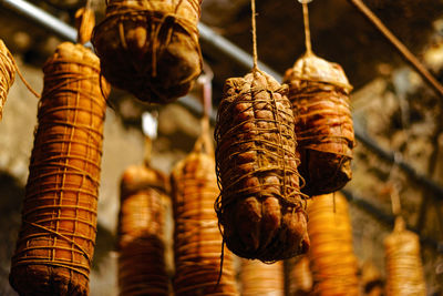 Close-up of salami maturing in the cellar