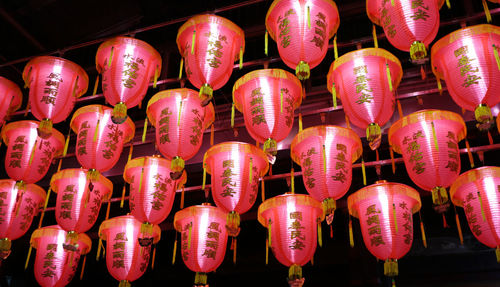 Full frame shot of illuminated lanterns hanging at night