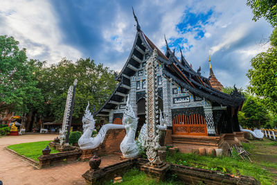 Panoramic view of temple against building
