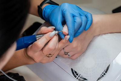 Midsection of doctor examining patient