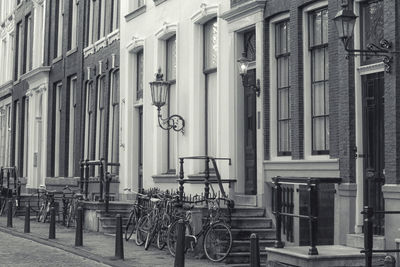 Bicycle against building in city