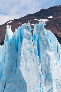 Scenic view of frozen landscape against sky