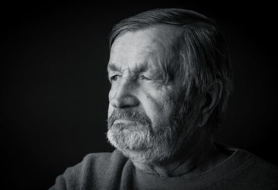 Elderly pensive man black and white portrait