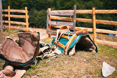 Closeup of pack saddle near the wooden fence in mountains