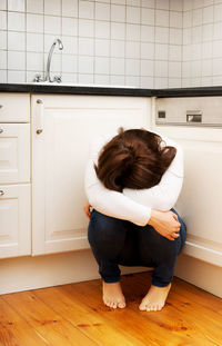 Rear view of woman at home