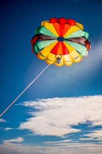 Low angle view of balloons against sky