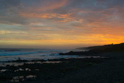 Scenic view of sea against sky during sunset