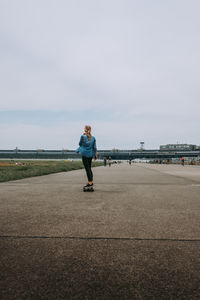 Full length of man standing on sea against sky