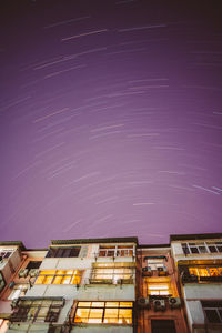 Low angle view of building against sky at night