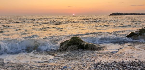 Scenic view of sea against sky during sunset