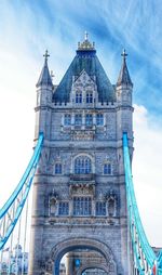 Low angle view of tower bridge against sky