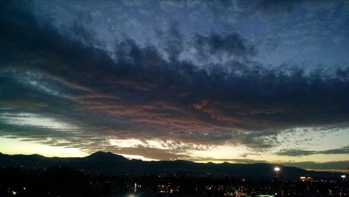 Scenic view of landscape against cloudy sky