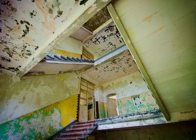 Low angle view of staircase in abandoned building