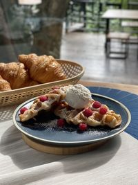 Close-up of breakfast in plate on table