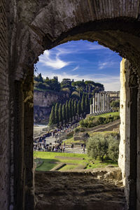 View of people at old ruins of building