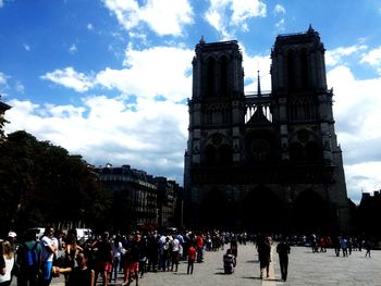 Tourists in front of building