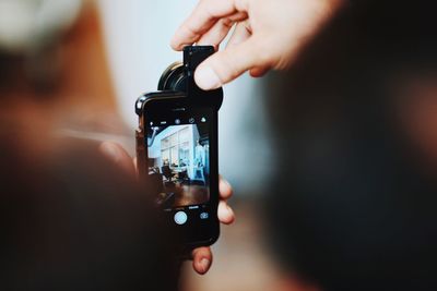 Close-up of hand holding smart phone