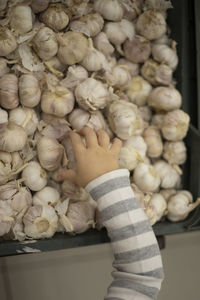 Low section of woman standing in market