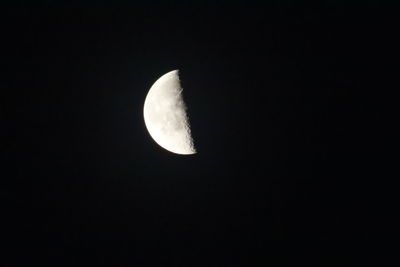 Low angle view of moon against sky at night