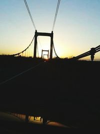 Silhouette of bridge at sunset