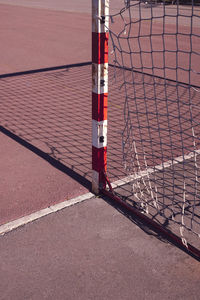 High angle view of red fence against brick wall