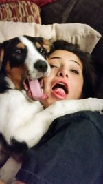 Close-up portrait of dog yawning at home