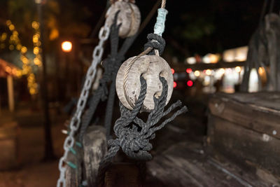 Close-up of statue against illuminated lights at night