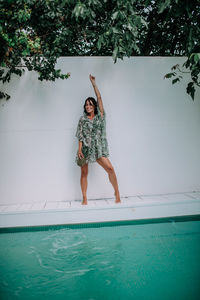 Full length of man standing in swimming pool