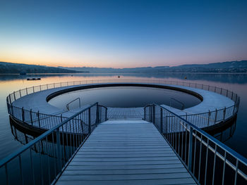 Scenic view of sea against clear sky at sunset