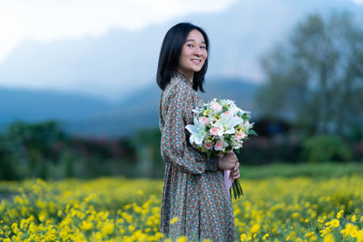 Woman standing on field