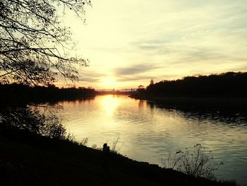 Scenic view of lake at sunset