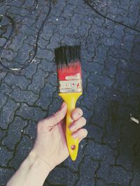 Close-up of hand holding umbrella