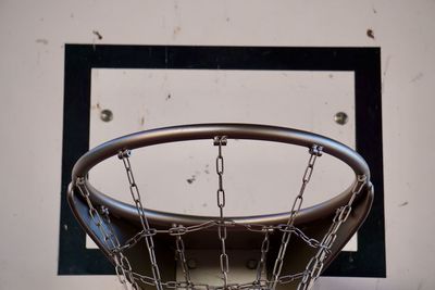 Basketball sport hoop with metallic net in the street
