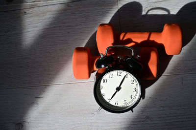 Close-up of clock on table