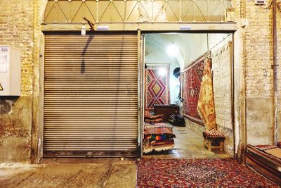 Missing half. carpet vendor - at the bazar in iran.