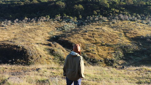 Rear view of man standing on land