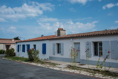 Street by building against sky