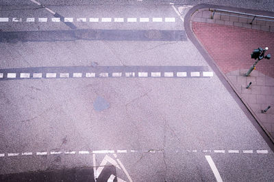 High angle view of man walking on road