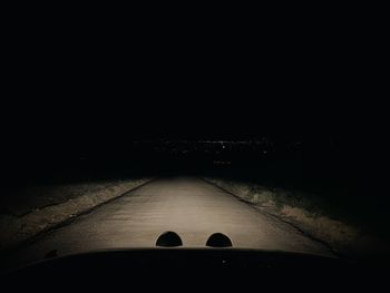 High angle view of person by road at night