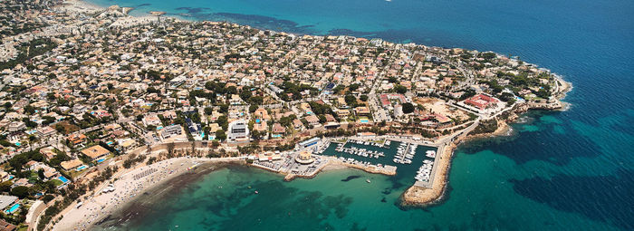 High angle view of people on beach against buildings