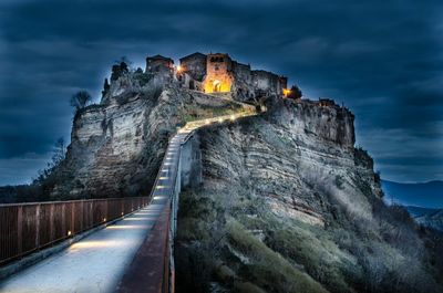 Illuminated civita di bagnoregio against sky at night