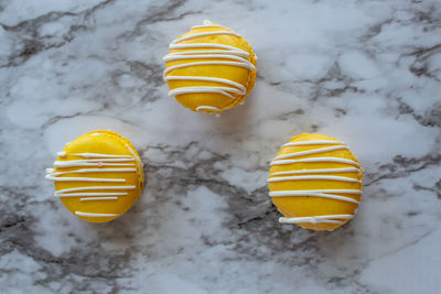 High angle view of yellow light bulb on snow