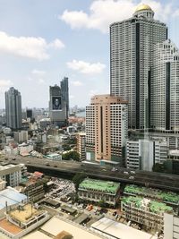 Modern buildings in city against sky