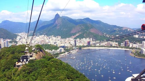 Panoramic view of buildings and mountains against sky