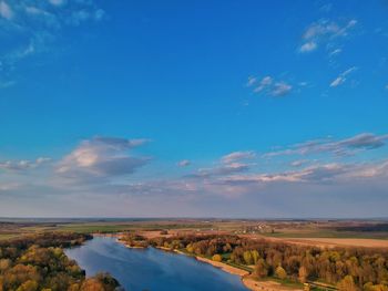 Scenic view of landscape against blue sky