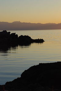 Scenic view of lake during sunset